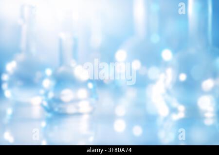 Blurred close-up of abstract test tubes with light passing through glass and liquid, colorful soft flares and serene mood. High quality photo Stock Photo