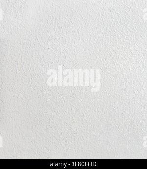 Close-up of a white painted wall with subtle orange peel texture. Clean neutral background suitable for interior, renovation, architecture, and design Stock Photo