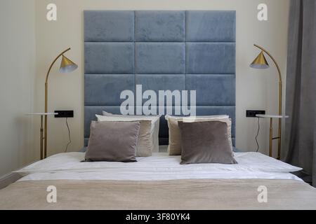 Cozy luxury bed in apartment Stock Photo