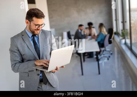 Team of programmers writing digital code in the metaverse and working together on the internet Stock Photo
