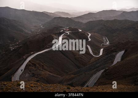 Winding mountain road through the High Atlas Mountains on Tizi nTichka Pass in Morocco during sunset Stock Photo