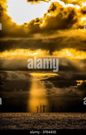 Late afternoon sunshine breaks through clouds over the Irish Sea near Walney Island on November 3, 2022 Stock Photo