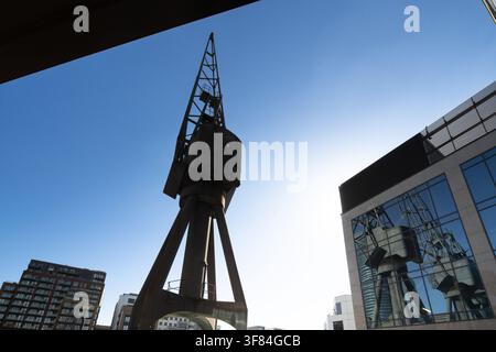 Historic crane meets the digital age: a preserved dockside landmark reflected in the glass of the LCY10 Data Centre, London Docklands. Stock Photo
