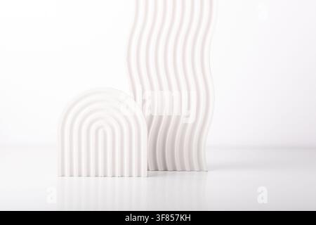 White concrete advertising stands. Gypsum podium for the presentation of cosmetic products. Minimal mock up. Stock Photo