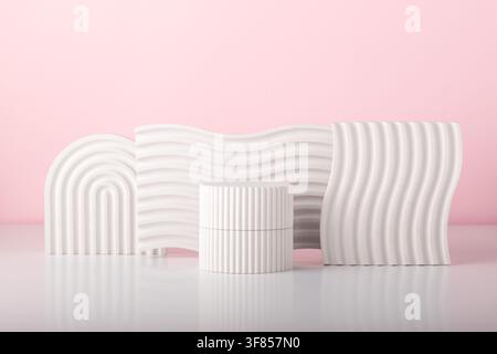 White concrete advertising stands. Gypsum podium for the presentation of cosmetic products. Minimal mock up. Stock Photo