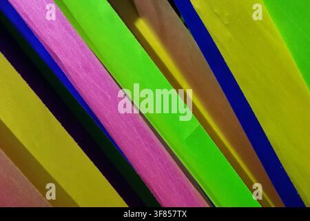Diagonal arrangement of colorful ribbons features bright pink, green, yellow, and blue strips. The ribbons are oriented diagonally across the image, c Stock Photo