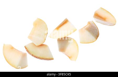 Pieces of melon flying in air on white background Stock Photo