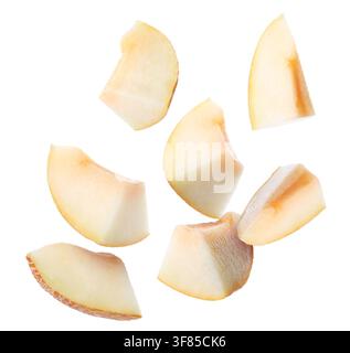 Fresh melon. Pieces flying in air on white background Stock Photo