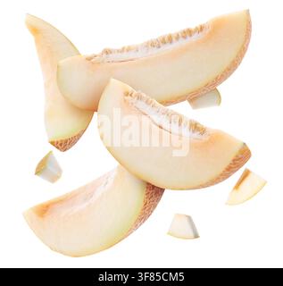 Sweet melon pieces flying in air on white background Stock Photo