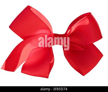 Bright red decorative ribbon bow with folded loops and textured fabric surface isolated on transparent background. Detailed festive design element sui Stock Photo