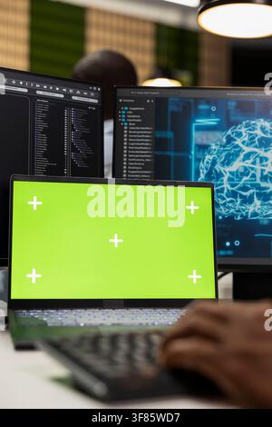 Isolated screen laptop used by admin in startup office testing AI machine learning algorithms. IT expert scaling productivity with artificial intelligence technology on chroma key notebook, closeup Stock Photo