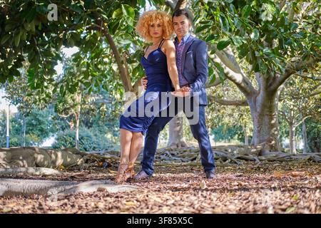 Professional dancers engaging in a passionate performance outdoors Stock Photo