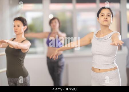 Group of female beginners rehearsing ballet dance Stock Photo