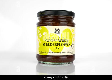 Gooseberry and Elderflower Jam in a glass jar on a white background - Wales, UK - 20 April 2026 Stock Photo