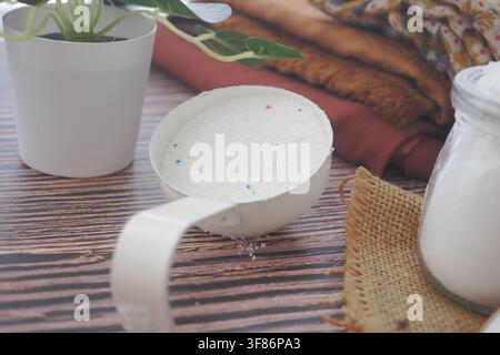 laundry detergent on a scoop on a table in closeup, Stock Photo
