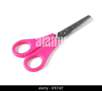 Pink handled childrens safety scissors with a ruler on the blade school supplies and crafting tool isolated on white background Stock Photo