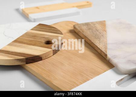 Assortment of wooden and marble cutting boards for kitchen and food preparation, home decor and culinary concepts, Assortment of various wooden and ma Stock Photo
