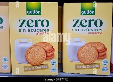 Denia, Spain - October 16, 2025.Gullon zero sugar free Maria Dorada biscuits are neatly arranged on a shelf in a supermarket in Spain. Shoppers can ea Stock Photo
