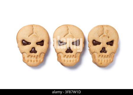 Halloween skull cookies with chocolate isolated on white background Stock Photo