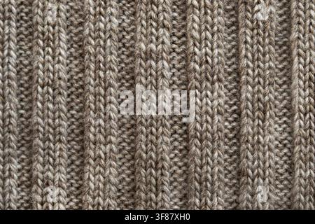 Grey wool yarn knitted texture closeup as a background Stock Photo