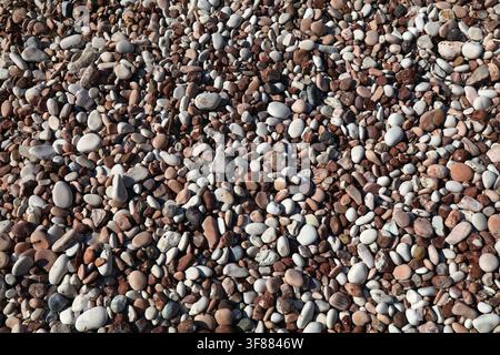 Colorful pebbly beach background from Sarande, Albania. Shingle beach. Stock Photo