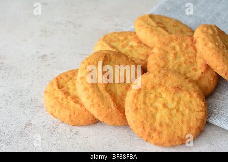 coconut Baked Cookies Piled on Textured Surface with Napkin copy space Stock Photo