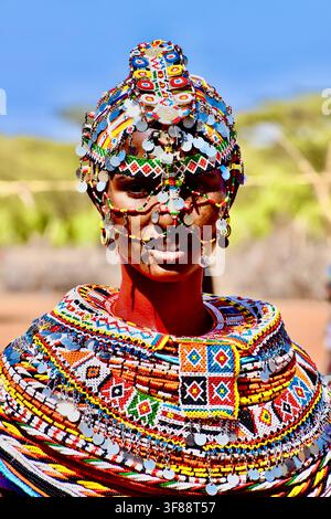 Lake Turkana, Kenya - 02/11/2018: portrait of veiled migrant Rashaida woman in traditional silver coin and bead headdress and colorful beaded collar Stock Photo