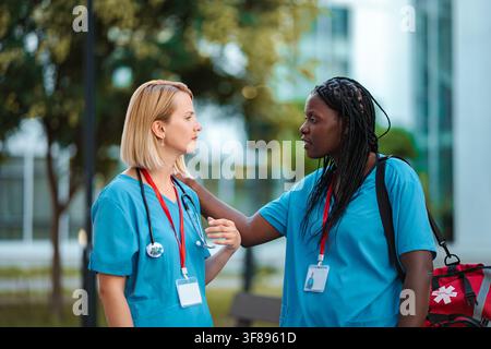 Healthcare workers supporting each other during a difficult time Stock Photo