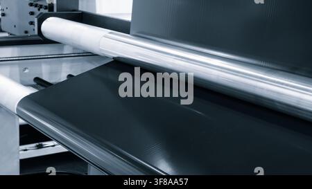Automatic polyethylene plastic bag production machine. Close-up of roller of plastic bag production machine. product packaging concept Stock Photo