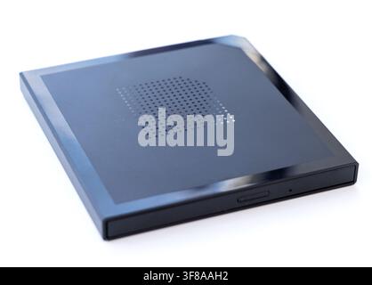 A sleek black external optical drive is presented on a white background Stock Photo