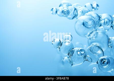 Glass molecules forming abstract scientific structure on blue Stock Photo