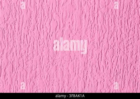Close-up of pink painted embossed anaglypta wallpaper wallcovering background. Retro interior design wallpaper. Stock Photo