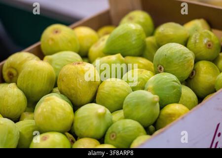 Fresh ripe green figs displayed in a box at a fruit and vegetable market in Bari, Puglia, Italy Stock Photo