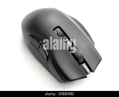A modern black computer mouse rests on a white background Stock Photo
