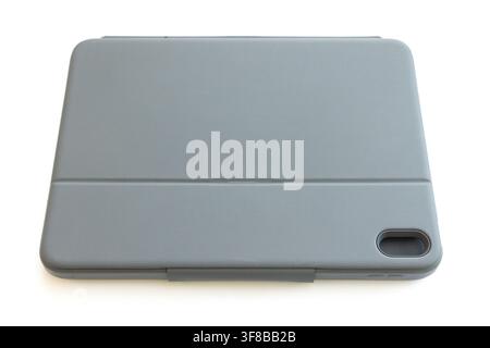 A closed grey tablet protective case rests on white background Stock Photo