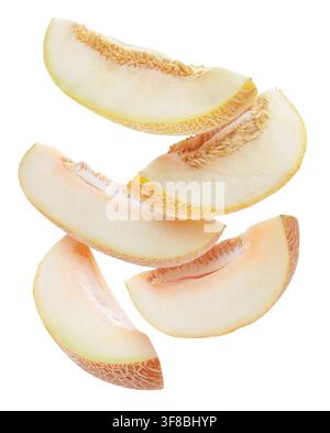 Sweet melon pieces flying in air on white background Stock Photo