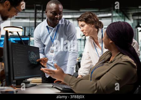 AI startup engineers doing brainstorming to create machine learning models. Coworkers collaborating on artificial intelligence project, working together to develop scalable solutions for businesses Stock Photo