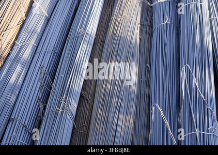Bundles of steel rebar displaying a metallic texture, ready for use as essential reinforcement material in modern building and civil engineering proje Stock Photo