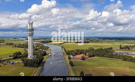 Aerial view of the ViaData telecommunications and data tower in Tjerkgaast, Friesland, Netherlands, housing antennas, network equipment and data cente Stock Photo