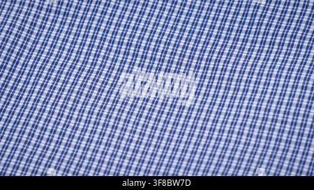 Blue Checkered Fabric Texture Background Close Up, suitable for shirt material, clothing background, textile design, apparel, and fashion pattern Stock Photo
