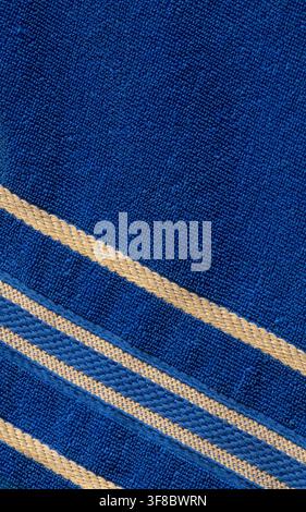 Blue Fabric With Yellow Stripes Texture Background,suitable for textile background, traditional cloth, fashion design, sewing, and apparel concepts. Stock Photo