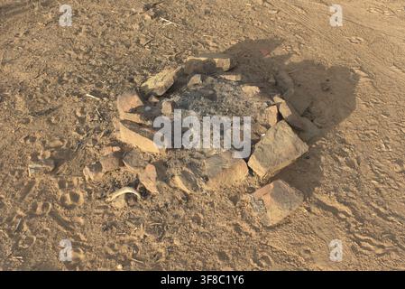 Focus on wildlife (deer tracks), camping, and fire restrictions in a red rock setting. Stock Photo