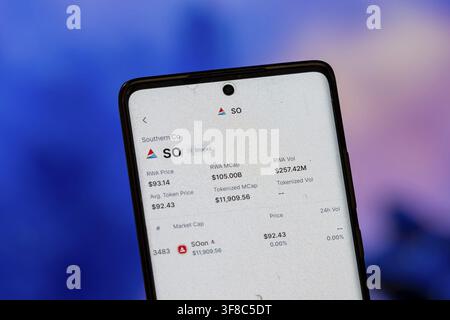 Smartphone displaying Southern Co stock information on financial app interface Stock Photo