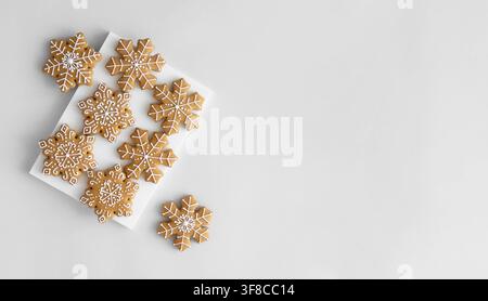 New Year's traditional gingerbread cookies decorated with sugar icing on a light background Stock Photo