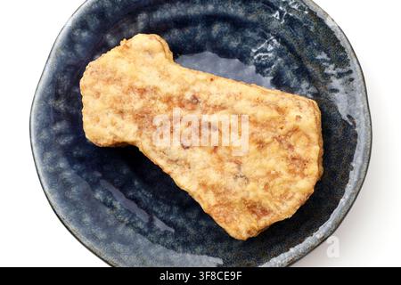Japanese squid-shaped tempura snacks in a dish isolated on white background Stock Photo