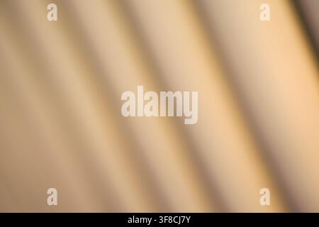 Soft-focus abstract featuring diagonal stripes in warm beige and tan. Minimalist aesthetic perfect for professional backgrounds, web headers, or prese Stock Photo