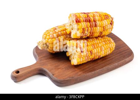 Boiled multicolored waxy corn cobs and cut segments isolated on white background Stock Photo