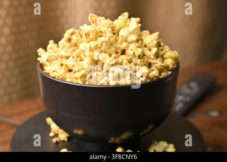 Bowl Of Golden Seasoned Popcorn Ready For Movie Night Snack Experiences Stock Photo