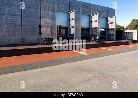 Road, car background, automotive backplate, parking area outside cafe featuring modern architecture Stock Photo