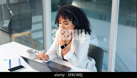 Woman, consultant and laptop with headset in office for customer service, online advice or CRM. Business, female person or agent with computer for Stock Photo